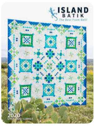 Island Batik 2020 Spring and Summer Catalog cover featuring blue and green medallion quilt
