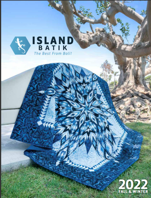 Island Batik 2022 Fall and Winter Catalog cover featuring blue starburst quilt